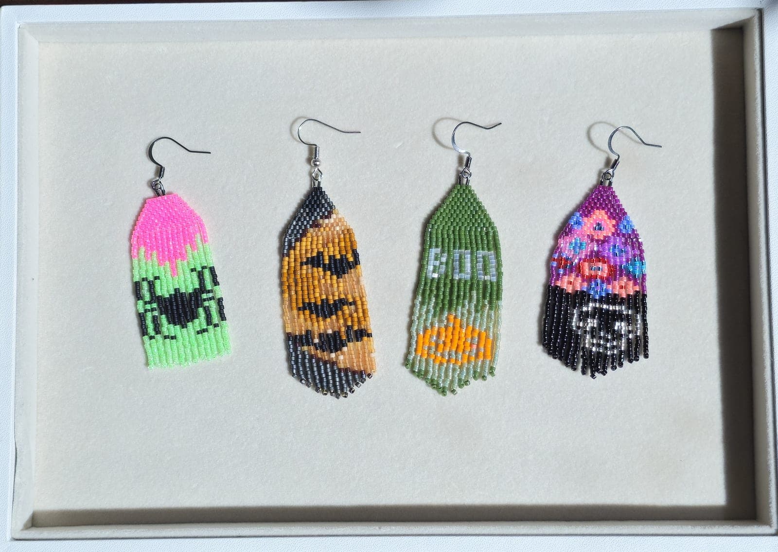Beaded brick stitch fringe Halloween earrings — boo ghost, pumpkin, BOO lettering, and skull designs